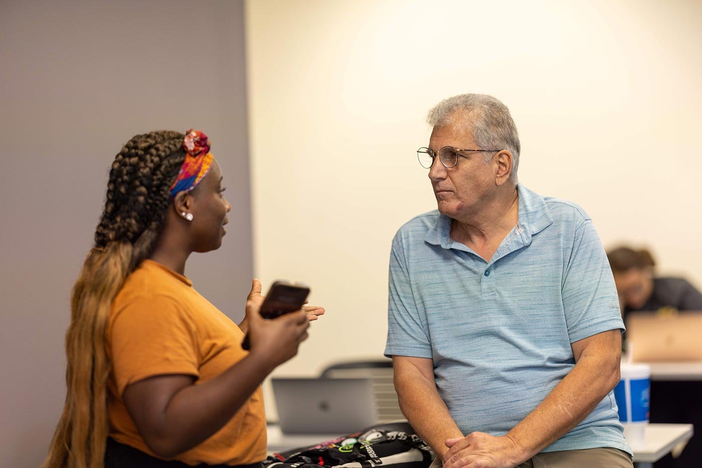 A student talks with a mentor in a classroom, reflecting the collaborative learning within this ASU sentencing certificate.