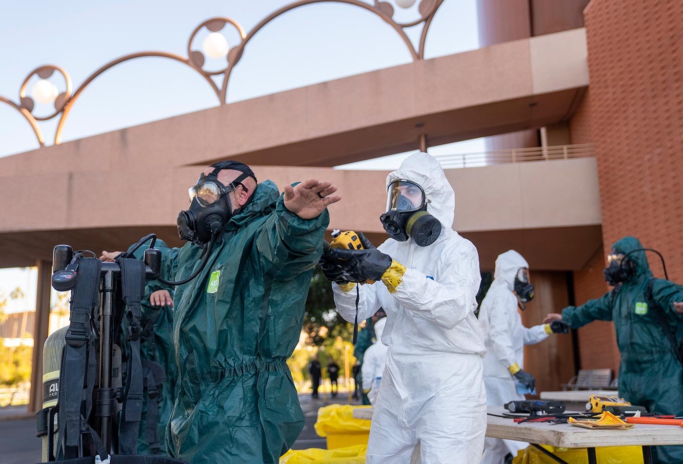 Personnel in protective gear run a safety drill on ASU's campus, reflecting the hands-on training in this concentration.