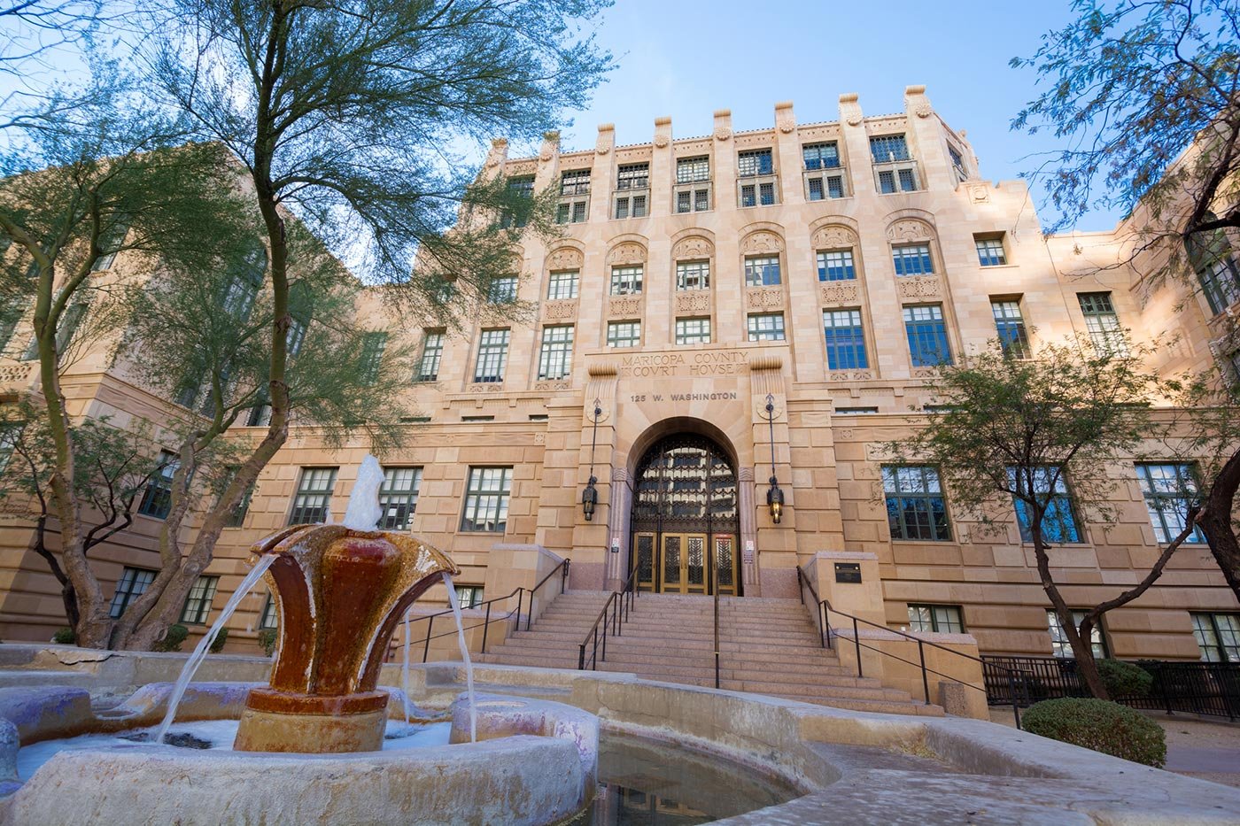 The Maricopa County courthouse rises against the sky, illustrating the legal grounding taught in this Criminal Justice certificate.