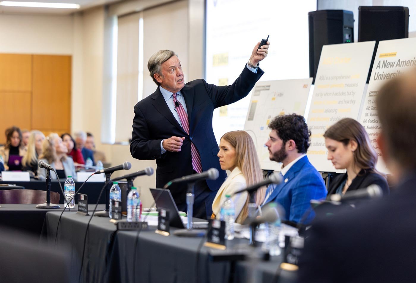 ASU President Michael Crow speaks at a conference, reflecting the leadership principles explored in this Leadership and Ethics certificate.