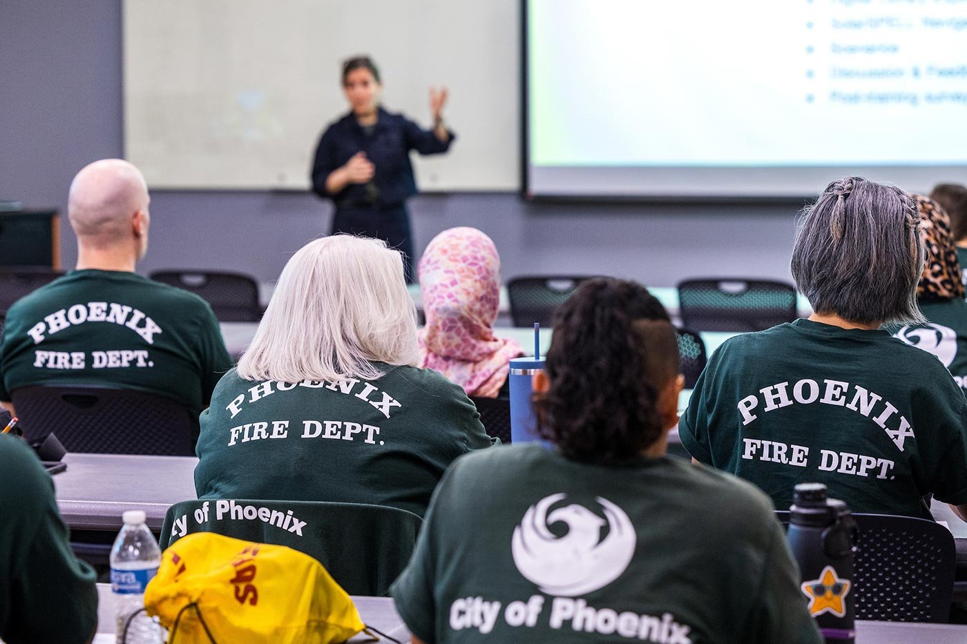 Phoenix Fire Department participants engage with a classroom speaker, reflecting the teamwork built in ASU's Public Safety Leadership program.