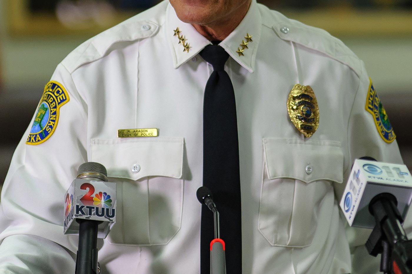 A police chief in a formal uniform speaks at a press briefing, demonstrating leadership in ASU’s Public Safety Leadership and Administration program.