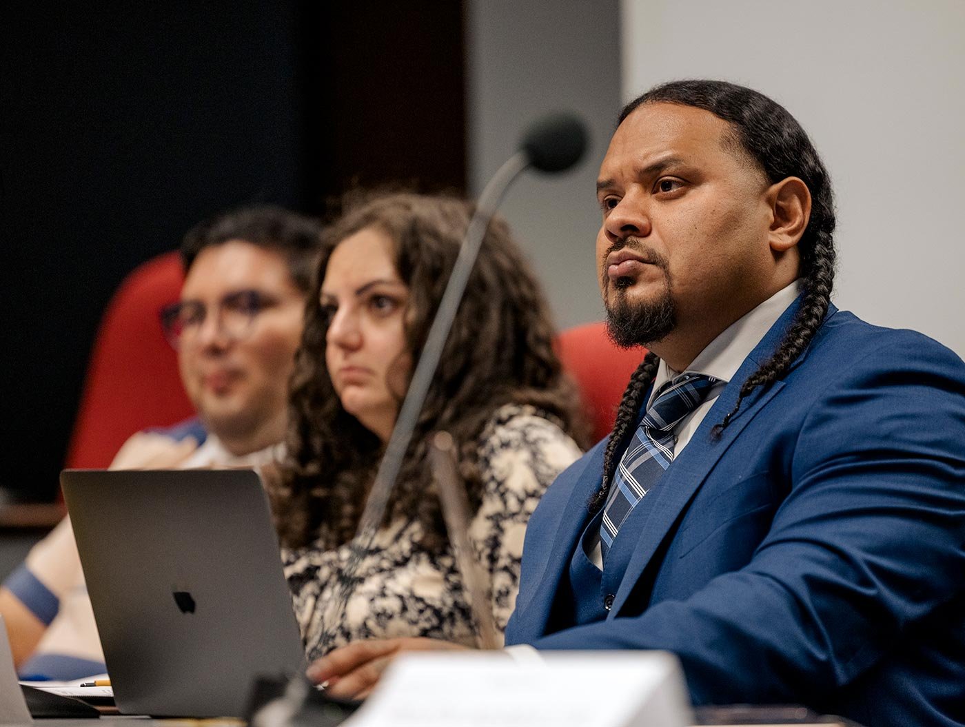 Students engage in discussion during a presentation, highlighting collaborative learning in ASU’s PhD in Public Administration and Policy program.