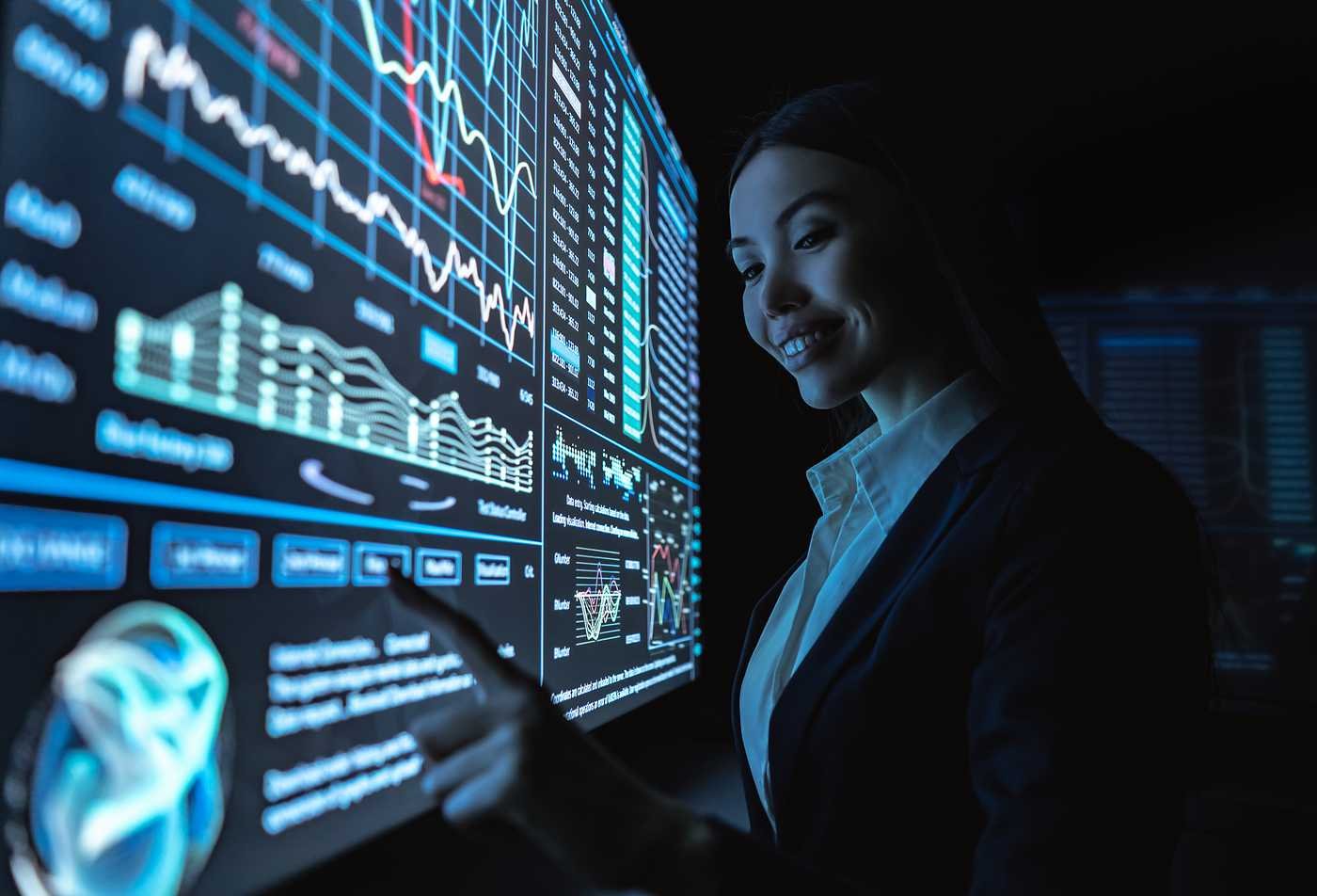 A professional analyzes interactive business dashboards, highlighting data-driven leadership in ASU's Global Management (Data Science), MGM program.