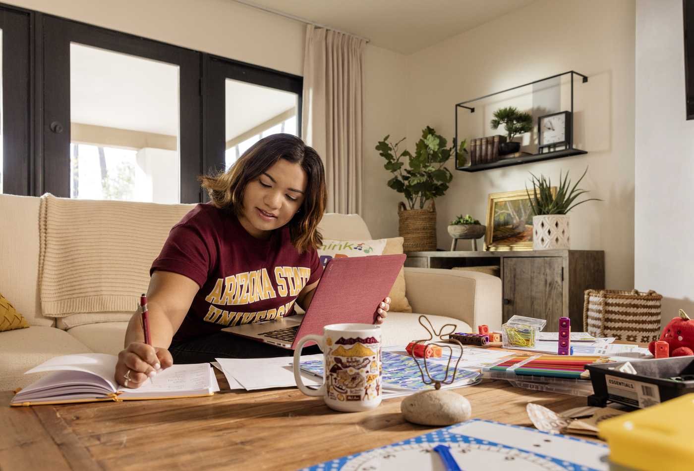 An ASU student studies at home, demonstrating the flexibilty of the Education Exploratory program.