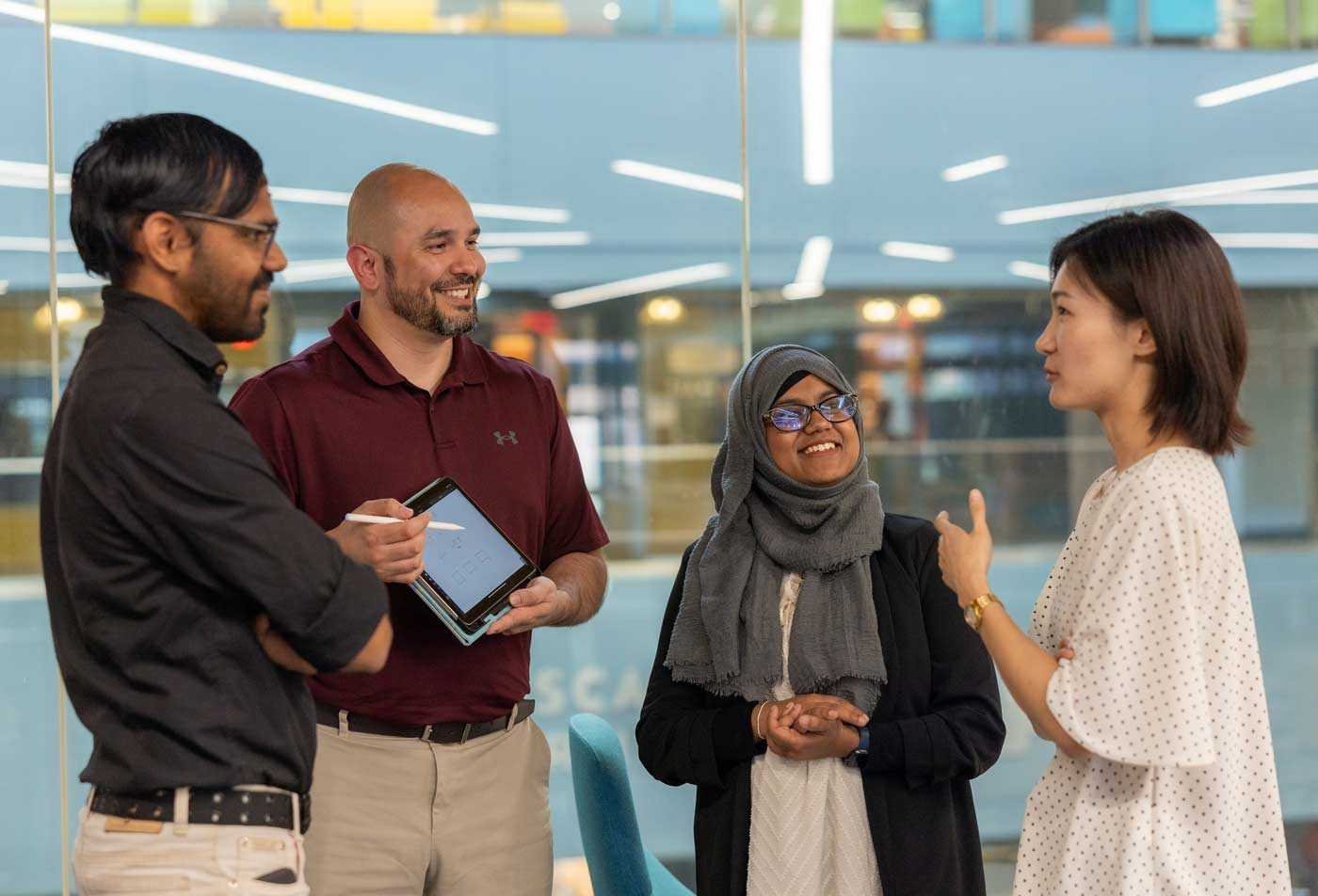 A group of professionals discusses instructional design in the BAE in Educational Studies (Instructional Design).