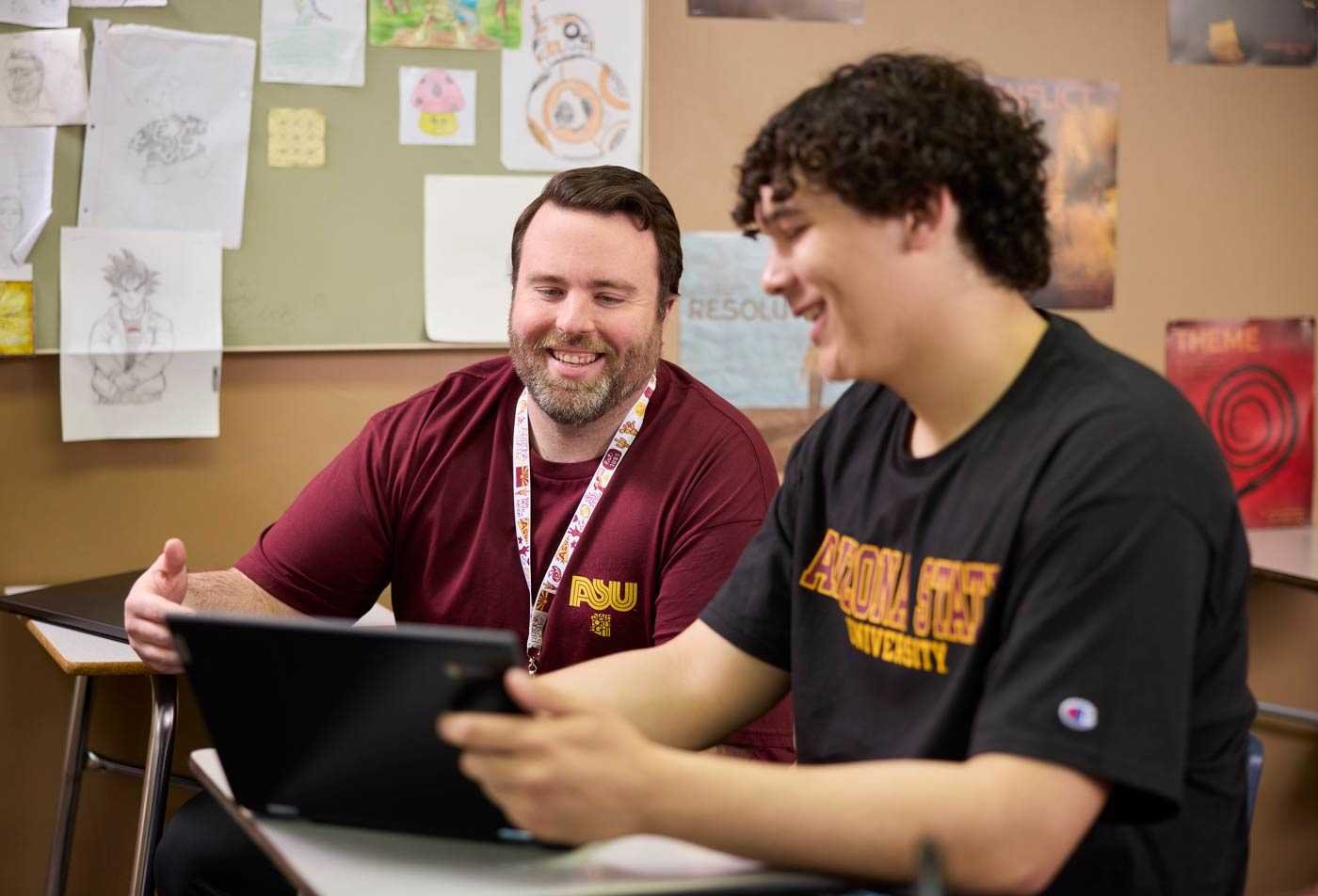 Two ASU students work together on a digital project in a classroom, showcasing collaborative learning in the certificate in Secondary Education