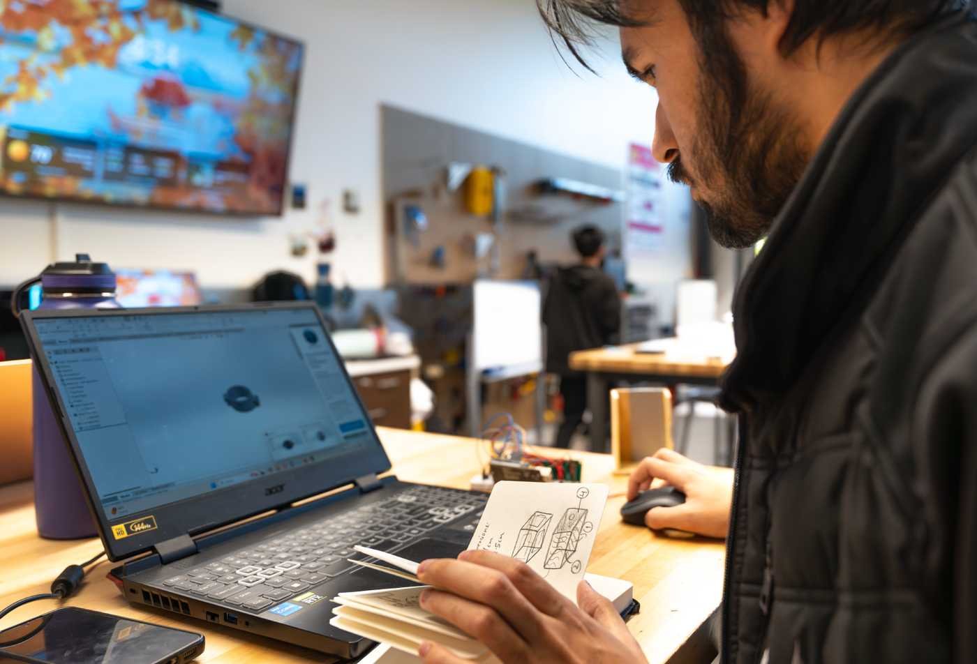 A student designs a 3D model on a laptop, exploring ASU's Exploratory Math, Physical Sciences, Engineering and Technology program.