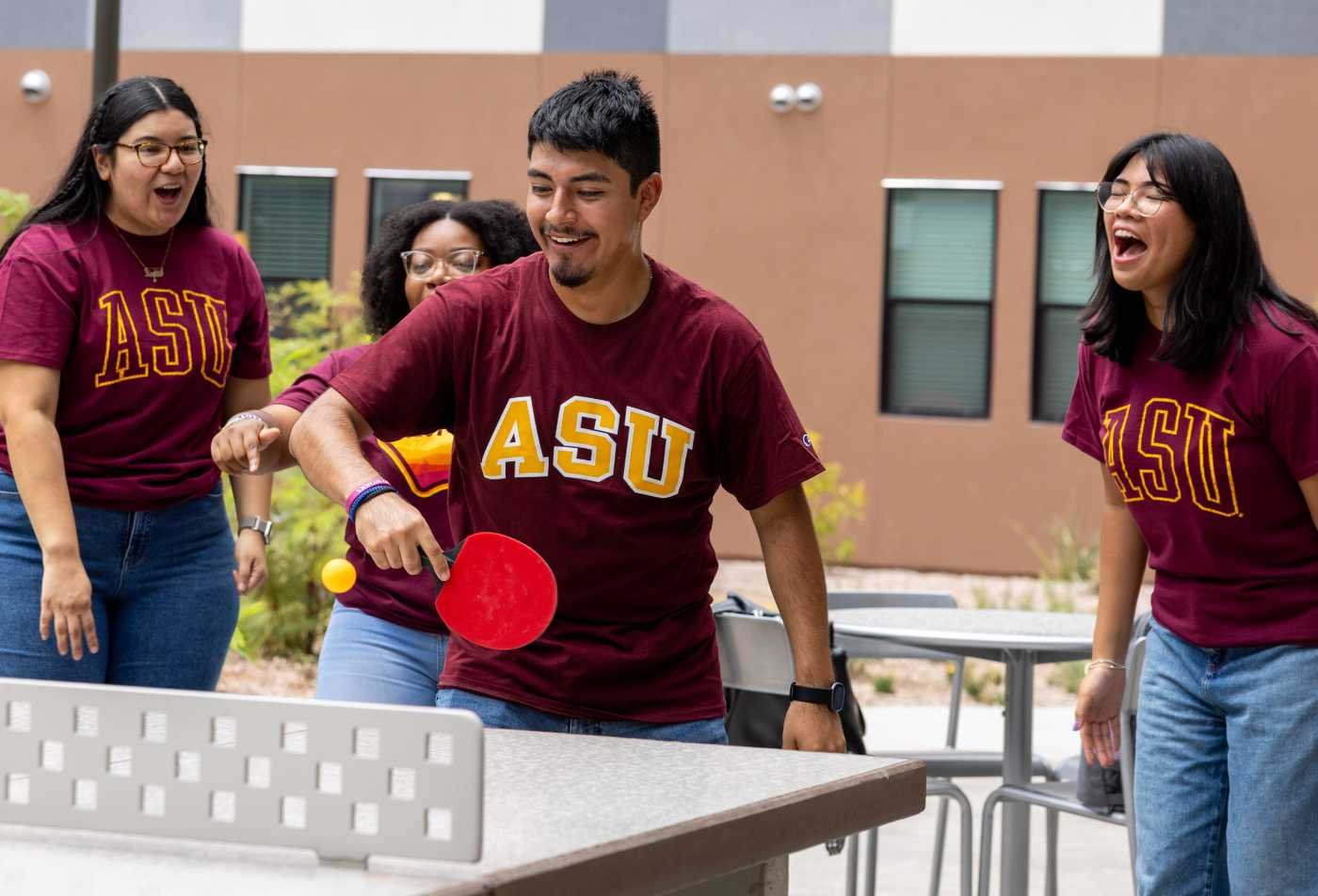 Students enjoy a campus game of table tennis together, reflecting interactive experiences in ASU's Arts and Humanities in Games certificate.