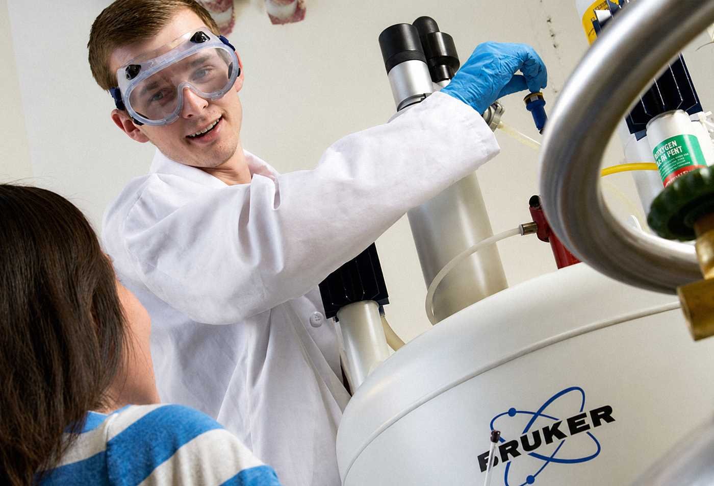A researcher operates advanced lab equipment, supporting discovery in ASU's Biological Data Science (Biotechnology), MS program.