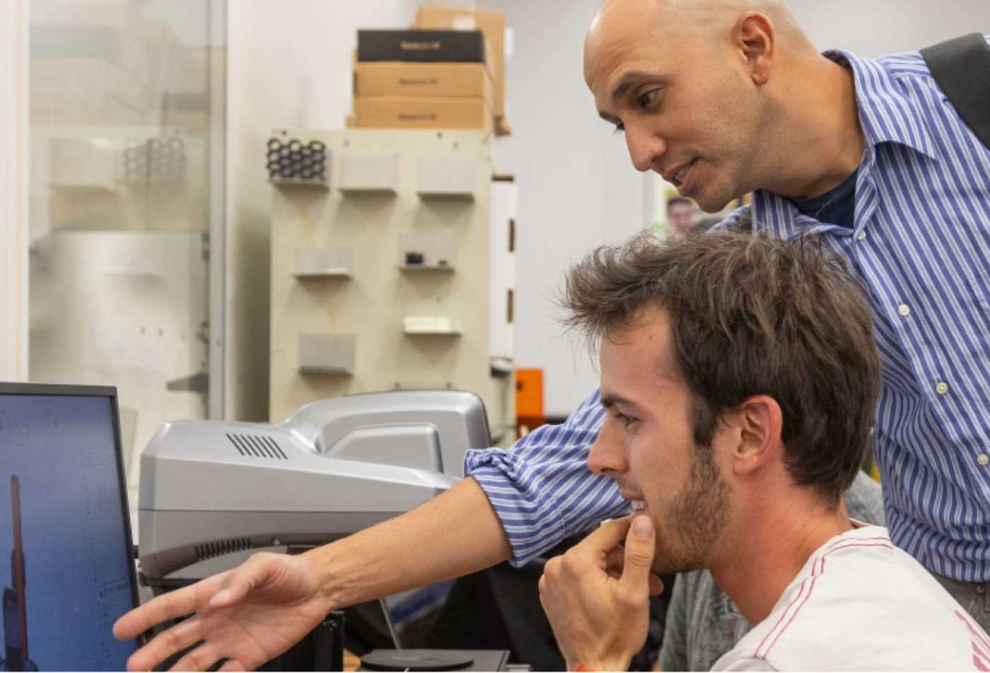 Researchers analyze data on a computer, highlighting quantitative study in ASU's Behavioral Data Science (Graduate Certificate).