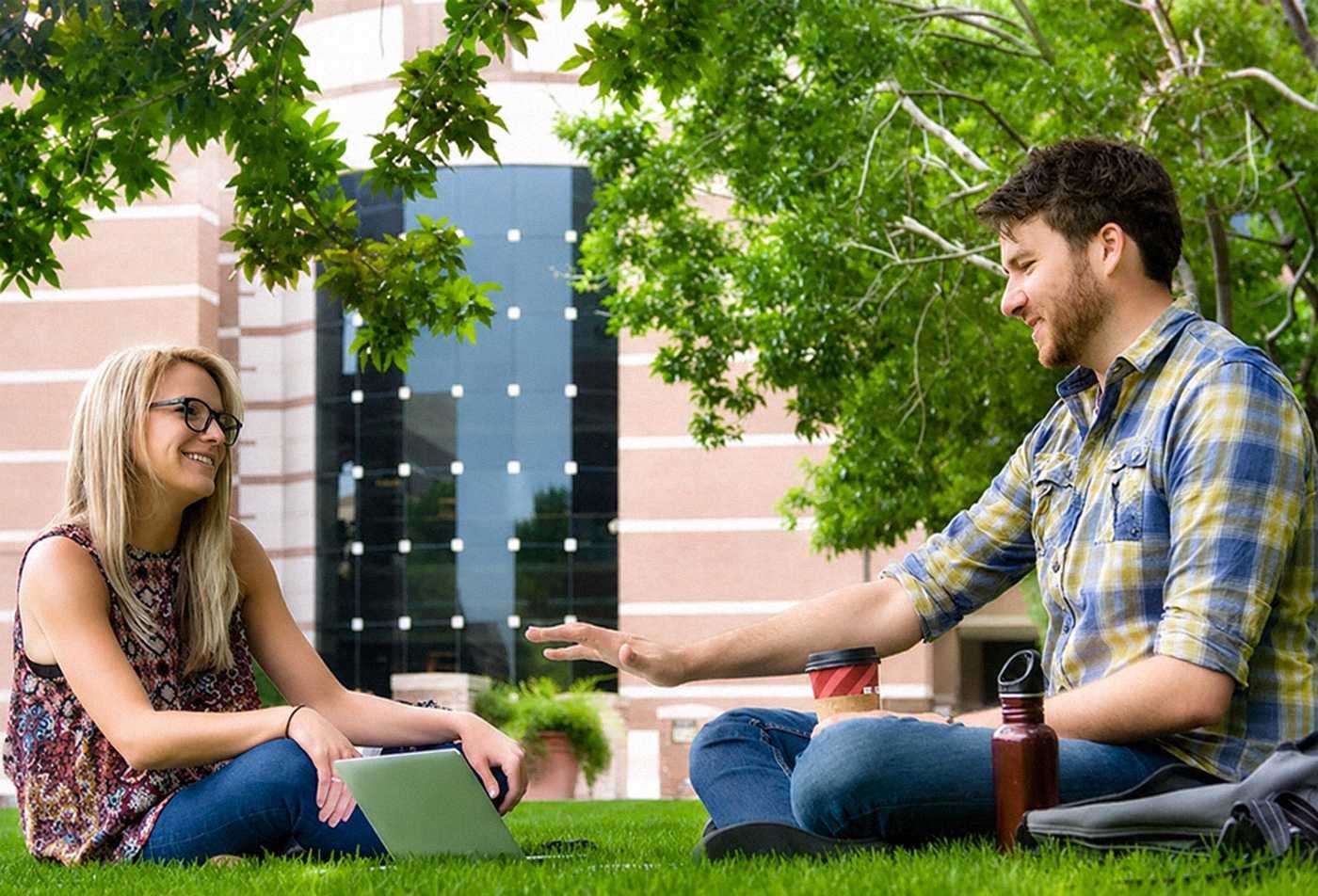 Two students discuss ideas on campus, developing constructive dialogue skills in ASU's Conflict Resolution minor.