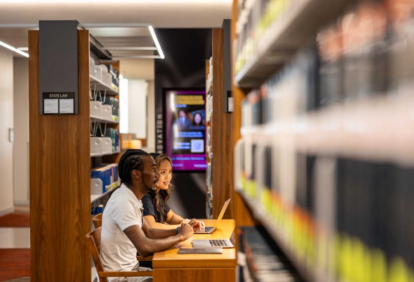 An illustration of people, scales and community support reflects equity and advocacy in ASU's Social Justice and Human Rights, BA program.