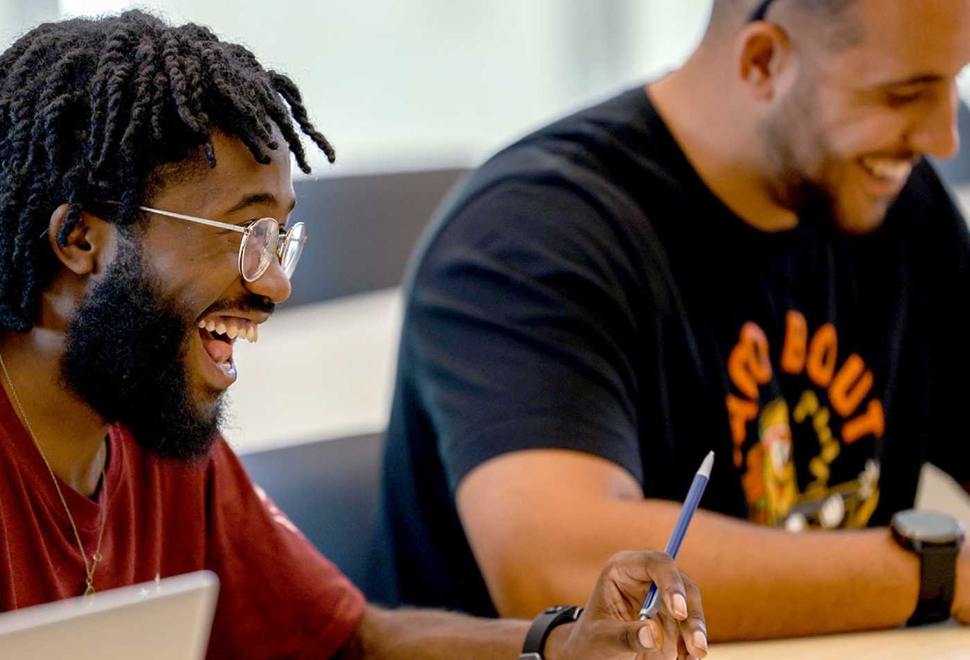 Students share ideas in a group, exploring connections in ASU's Psychological Fundamentals of Well-being (Graduate Certificate).