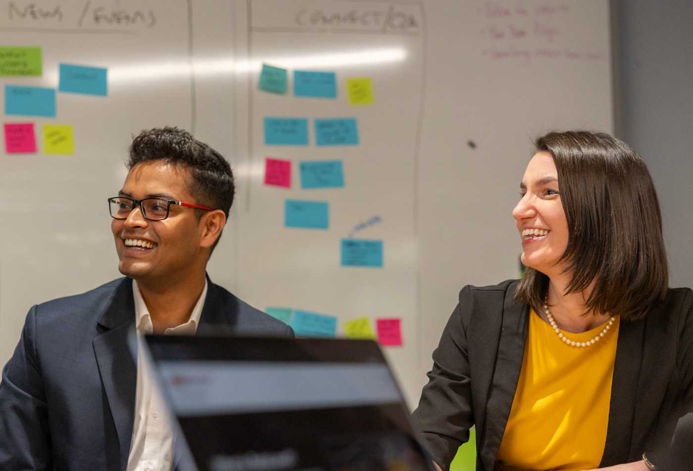 Professionals discuss workplace ideas, highlighting organizational behavior in ASU's Psychology (Industrial/Organizational Psychology), MS program.