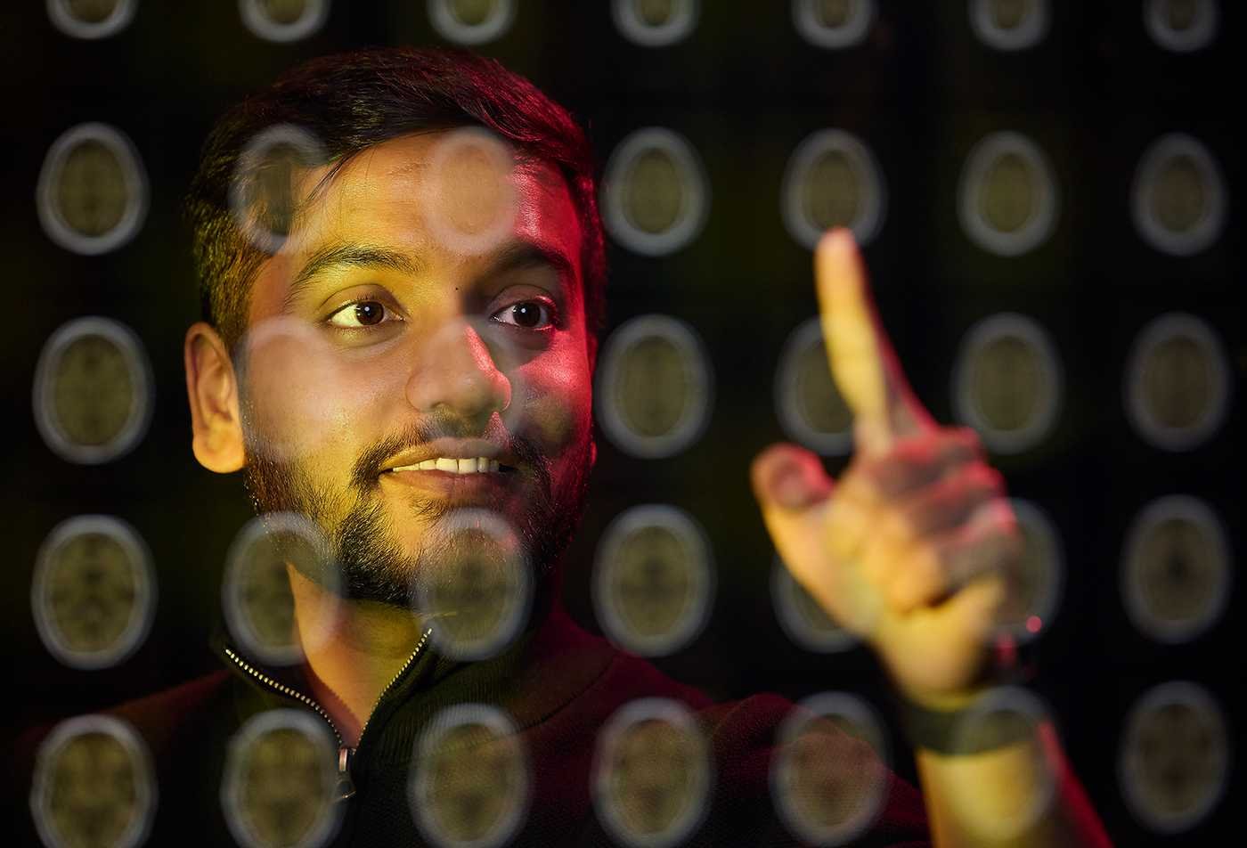 A student examines diagrams of the brain, exploring well-being in ASU's Psychology (Positive Psychology), BA program.