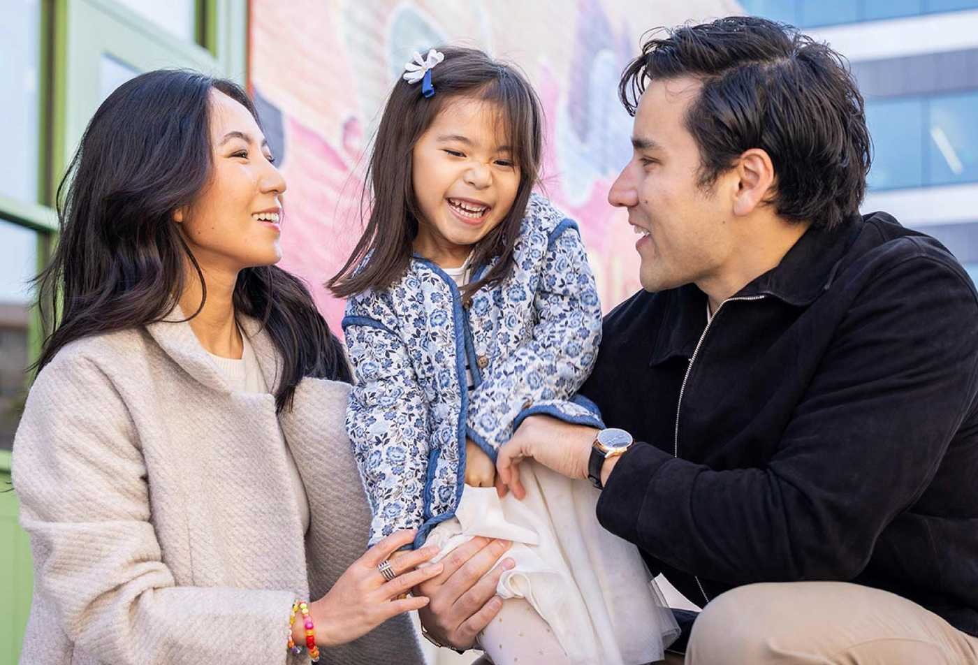 A family shares a joyful moment together, reflecting impact of ASU's Positive Psychology (Graduate Certificate).
