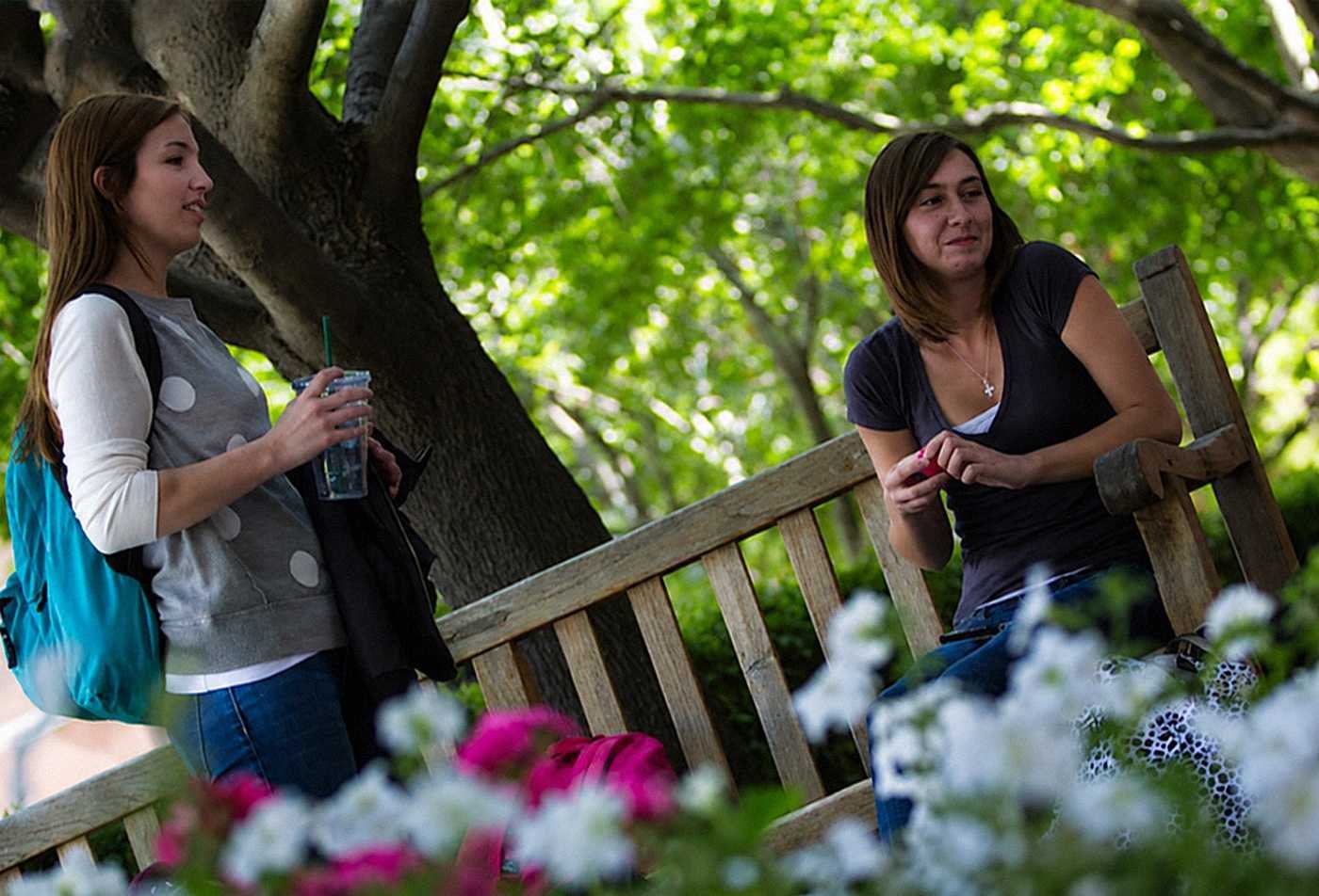 Students talk outdoors on campus, reflecting social interaction in ASU's Social and Behavioral Sciences, BS program.