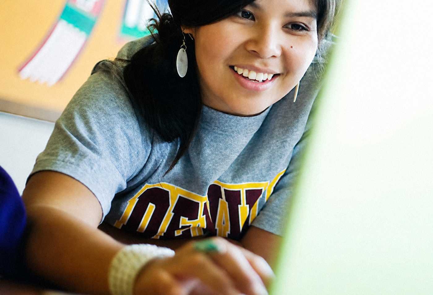 A student uses a laptop, exploring identity in ASU's Social and Cultural Analysis (Ethnicity, Race and Indigenous Studies), BA program.