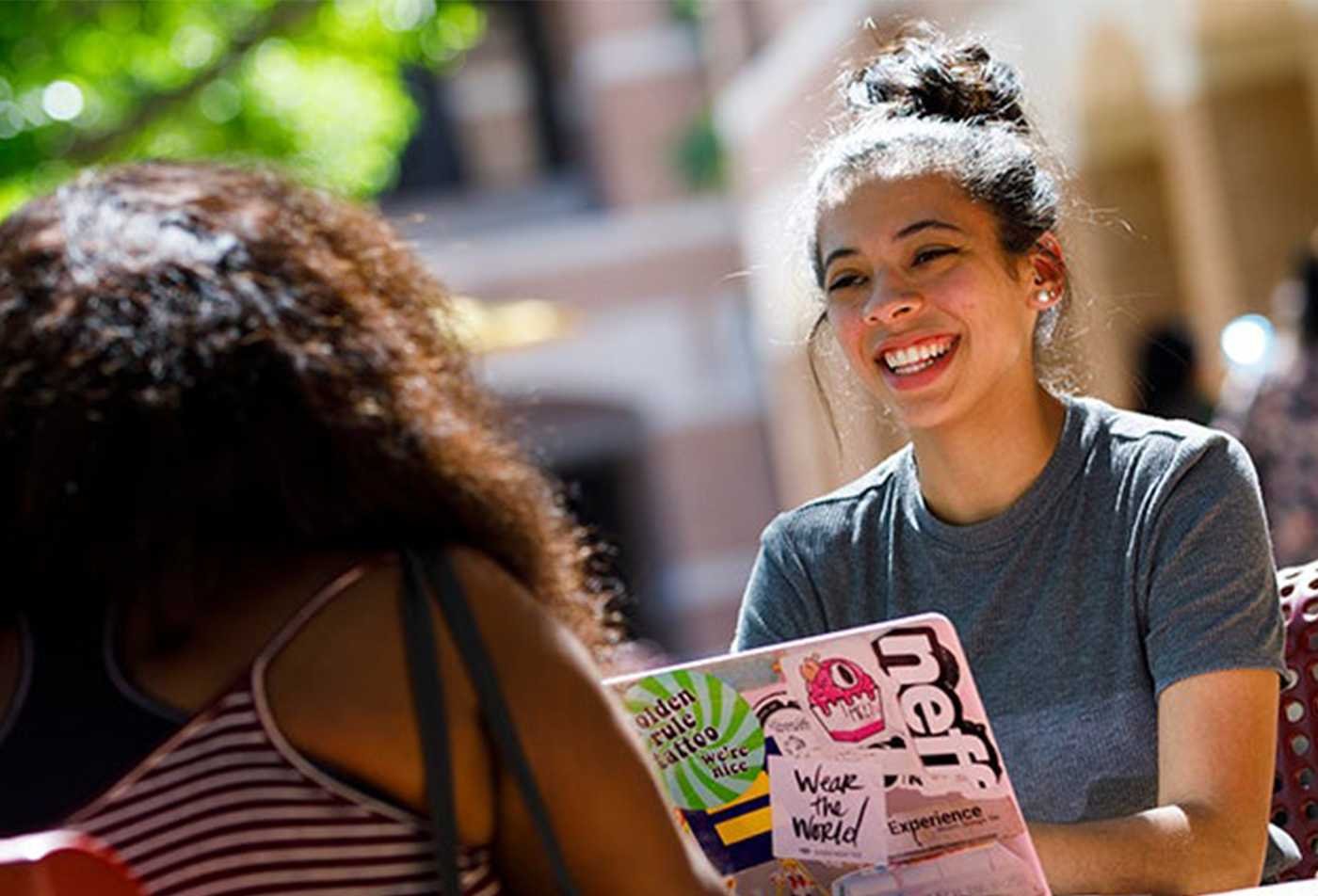Students discuss ideas outdoors, examining conflict and cooperation in ASU's Social and Cultural Analysis (Peace Studies), BA program.