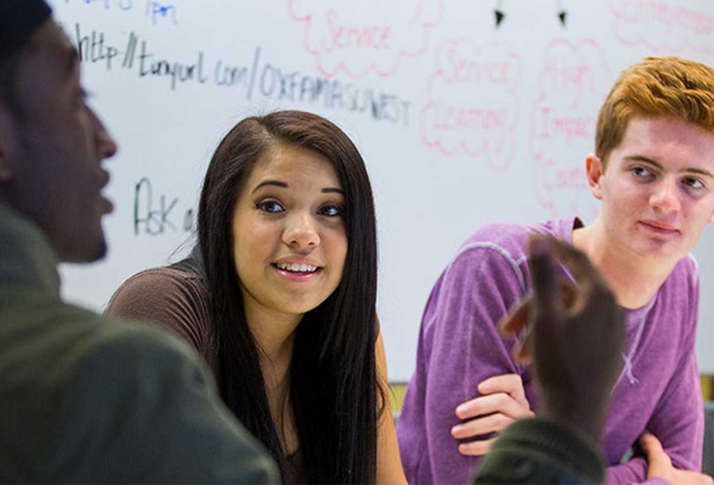 Students exchange perspectives during a group discussion, exploring social behavior in ASU's Sociology, BS program.