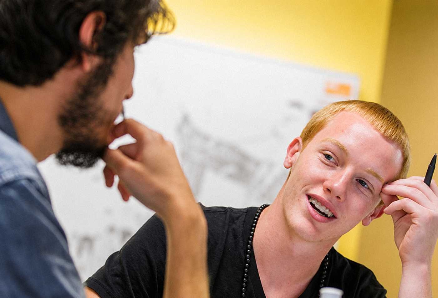 Students exchange ideas during a classroom discussion, supporting quantitative reasoning in ASU's Statistics minor.