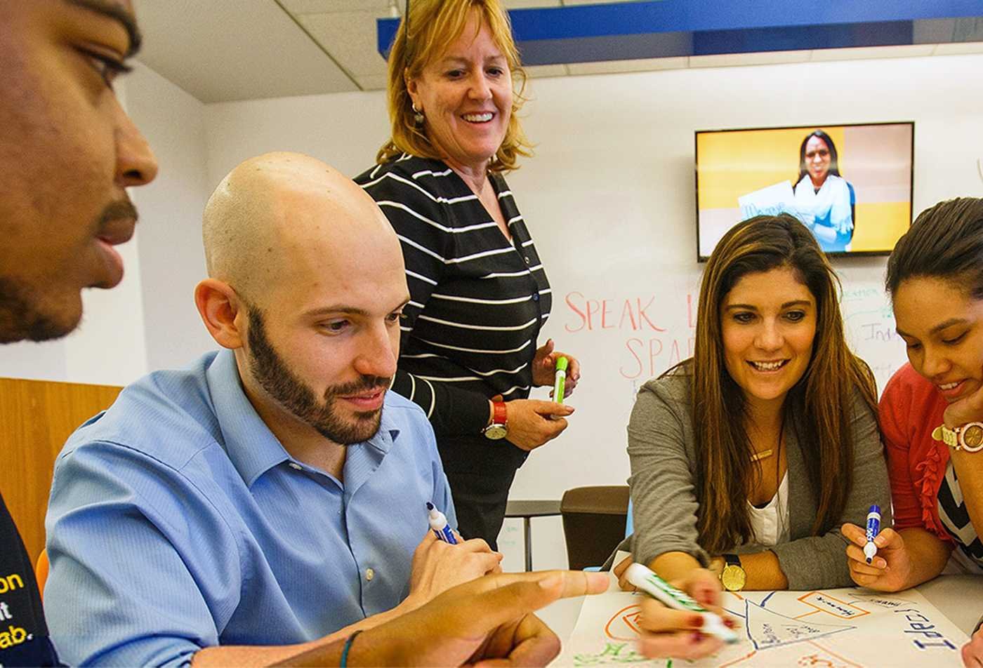 Students collaborate in a brainstorming session, developing interpersonal communication skills in ASU's Communication minor.